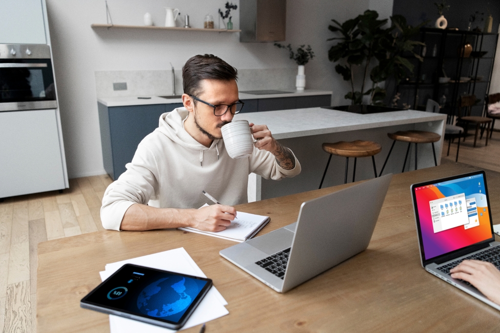 Person working on laptop from home office